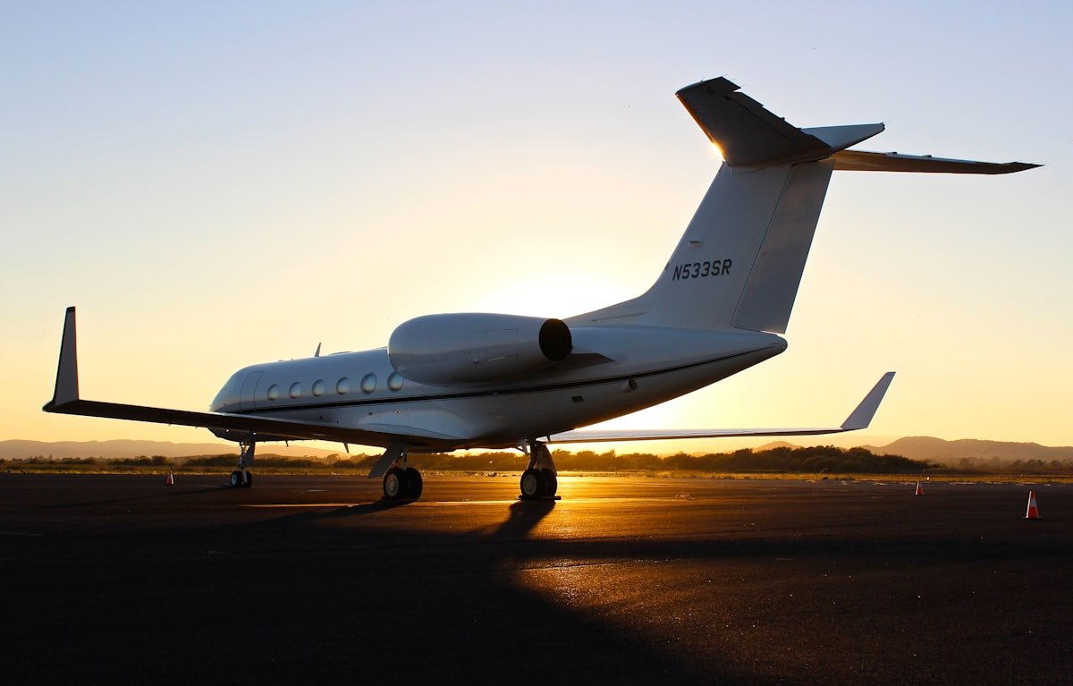 Gulfstream G550 private jet on the tarmac at golden hour